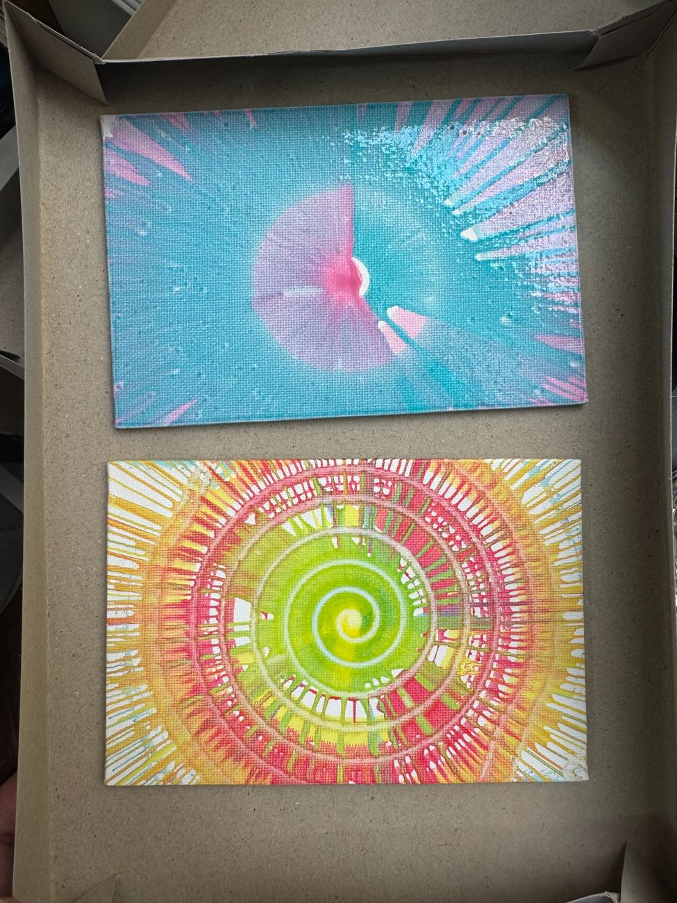 Two bright spin-art creations