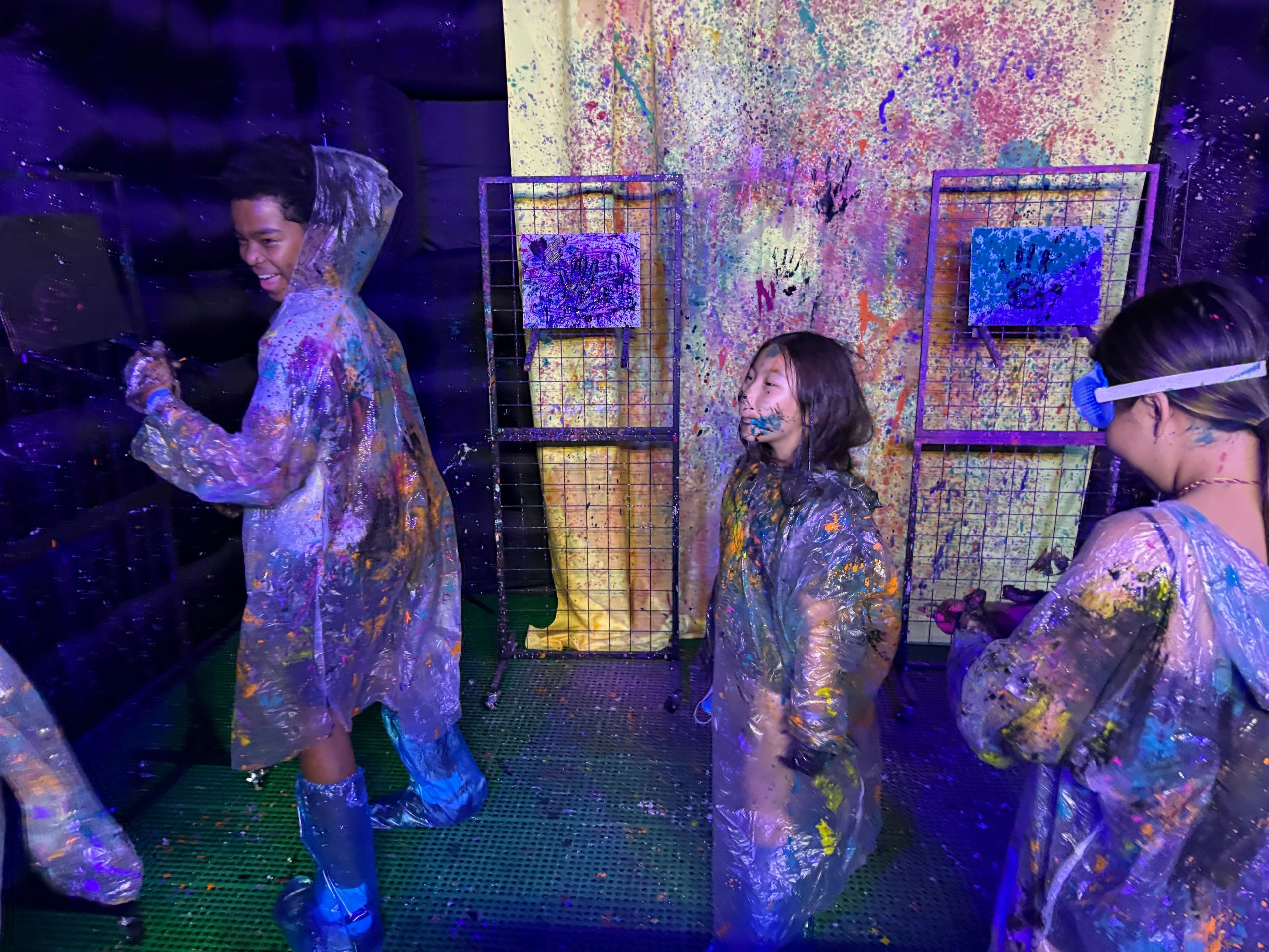 Friends painting in the glow room