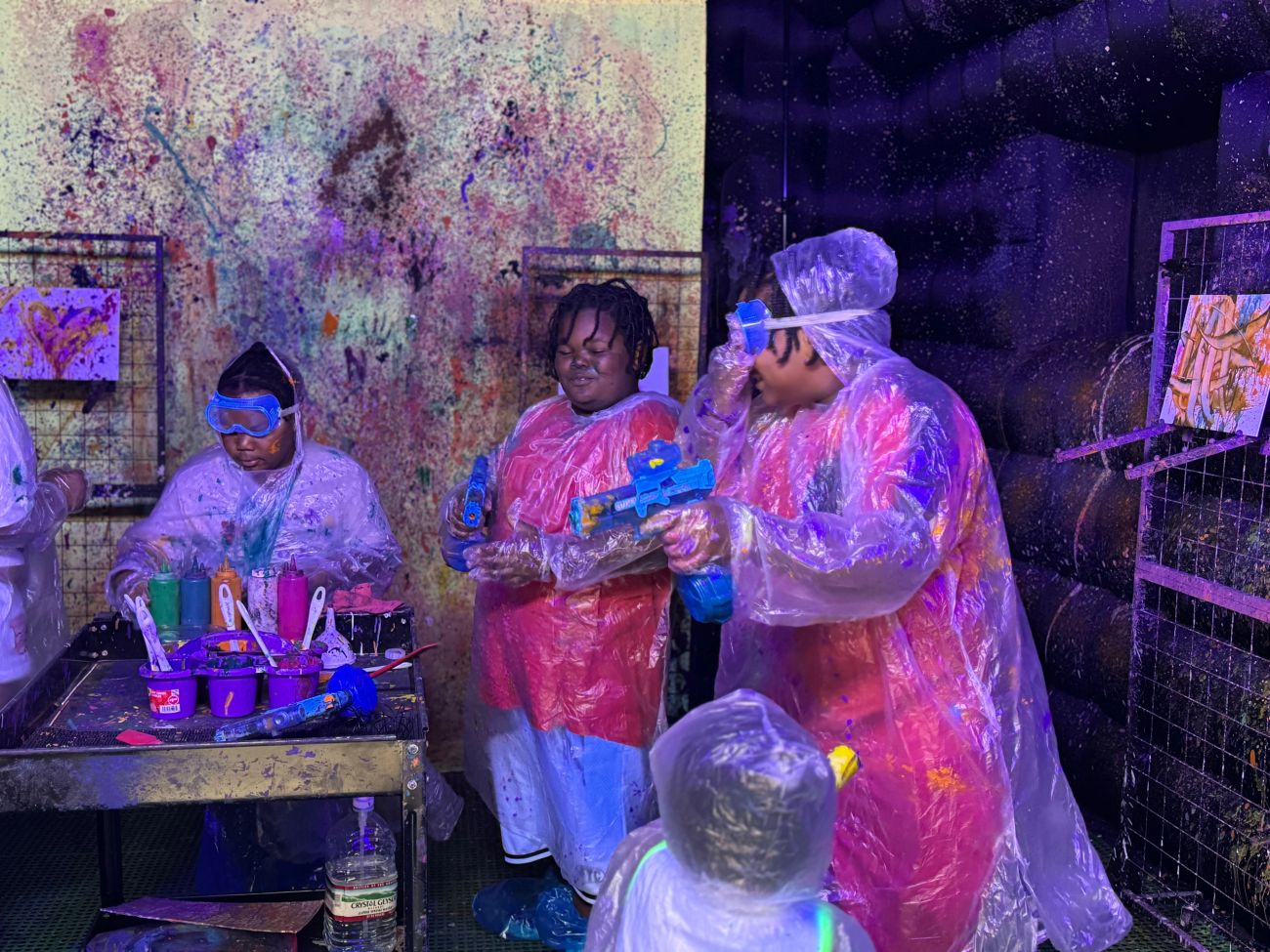 Friends enjoying a glow-paint session