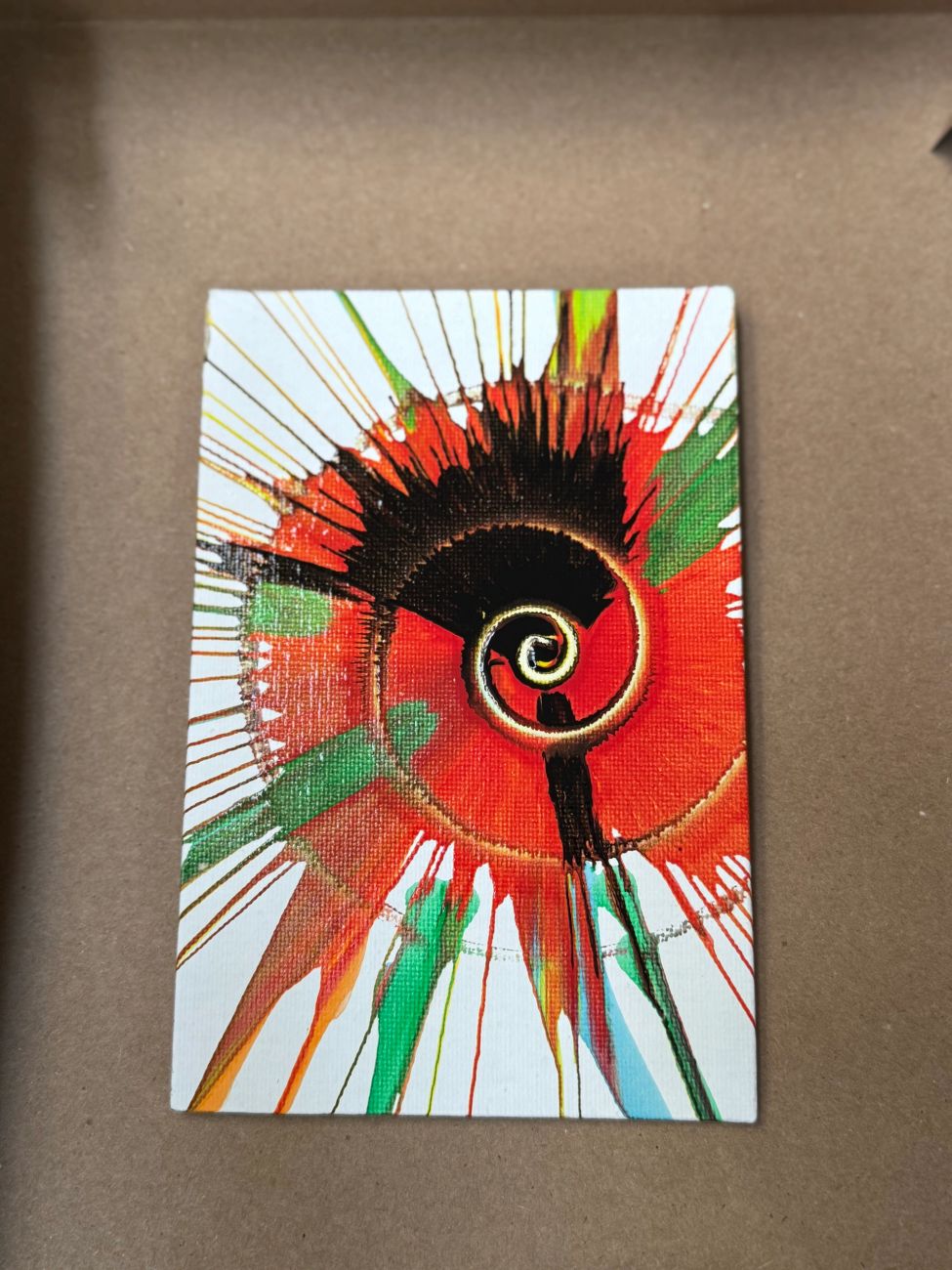 A bold red and green spin-art design
